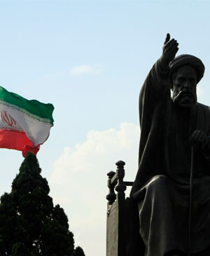 Iranian flag and Ayatollah Khomeini statue