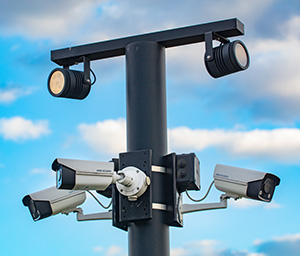 Stock.Adobe.com/Hikvision video surveillance cameras on pole. Ruslan.